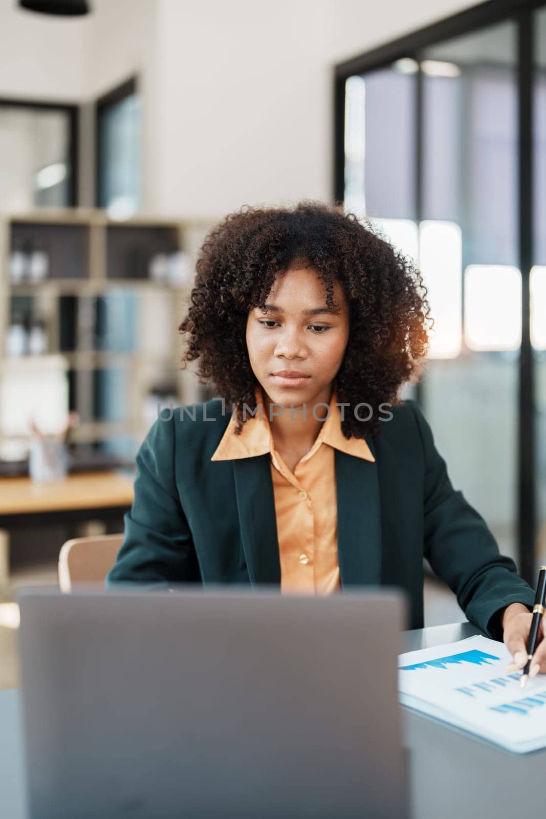Beautiful young teen American African business woman thoughtful confused looking at laptop computer, Stress while reading report or email. Online marketing problem, finance mistake, troubleshooting by Manastrong