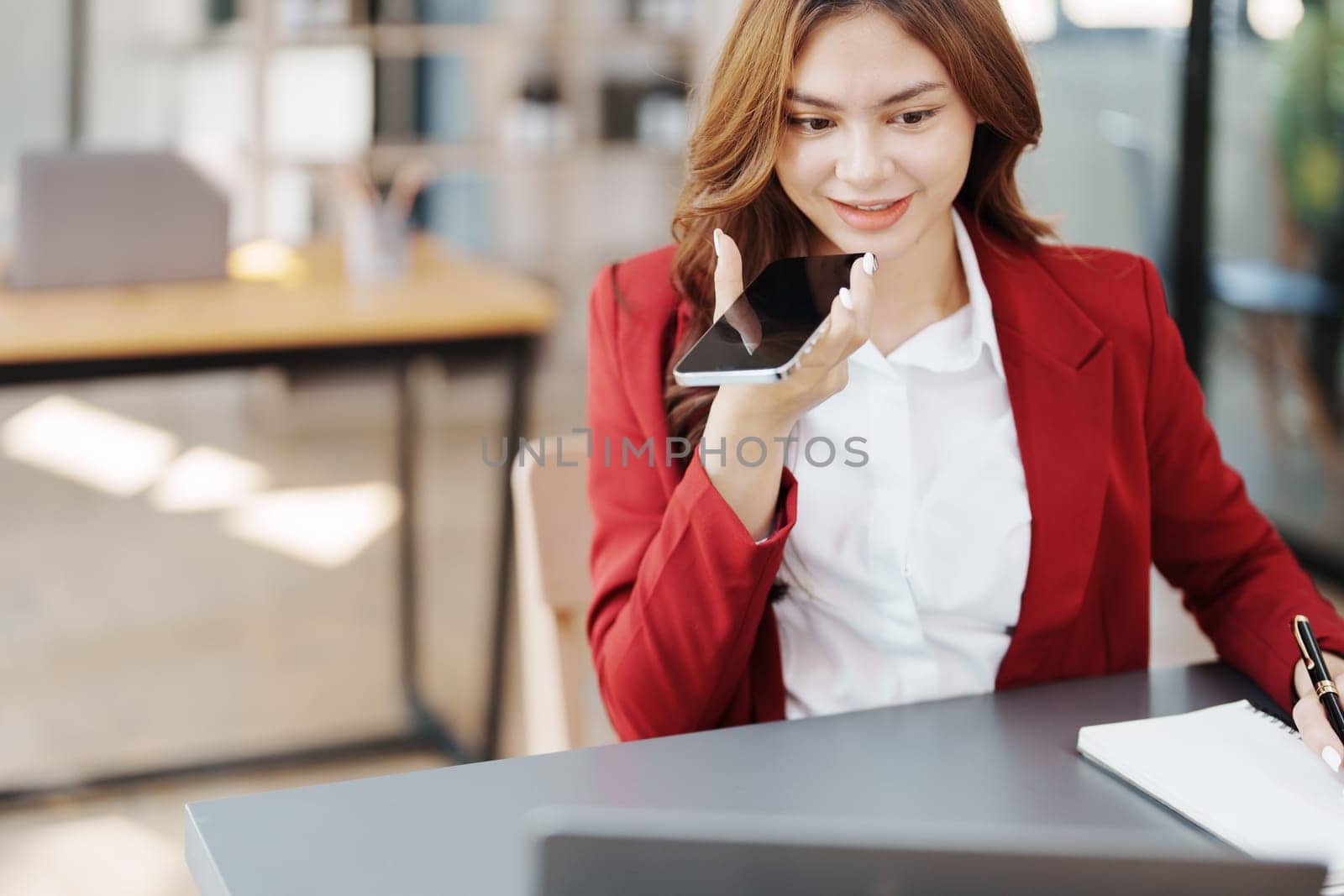 Beautiful young teen asian businesswoman using computer and smartphone mobile with planning working on financial document, tax, exchange, accounting and Financial advisor by Manastrong