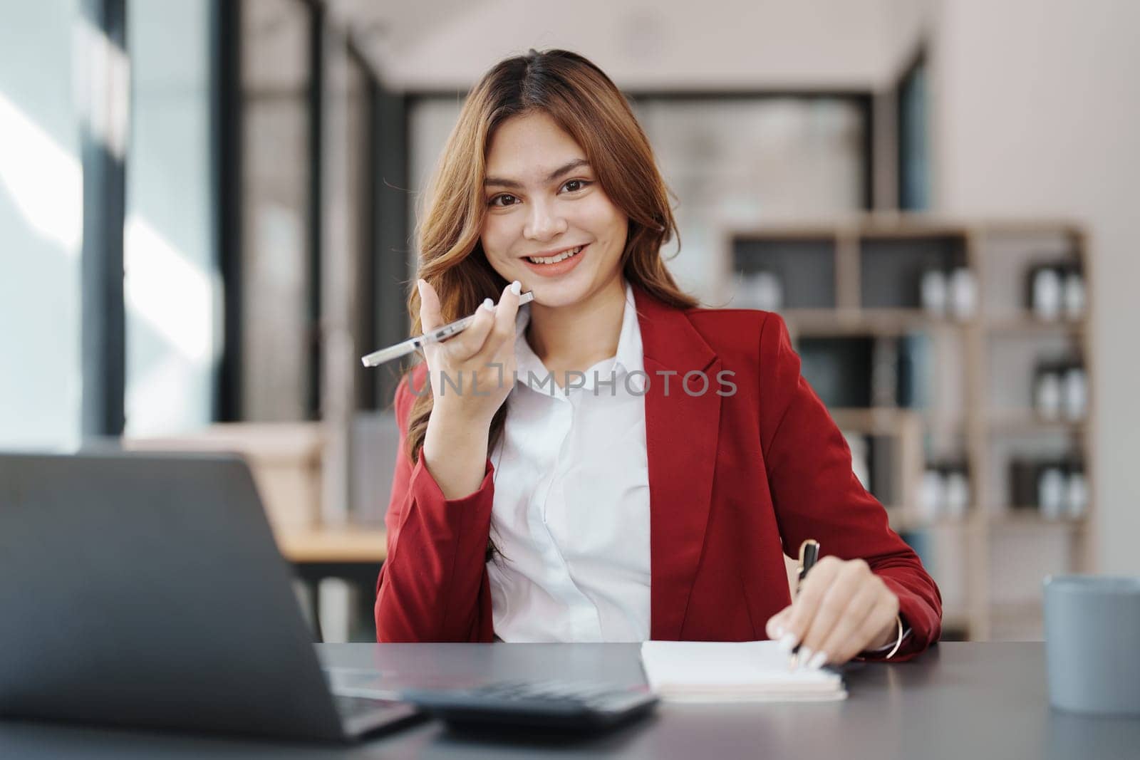 Beautiful young teen asian businesswoman using computer and smartphone mobile with planning working on financial document, tax, exchange, accounting and Financial advisor.