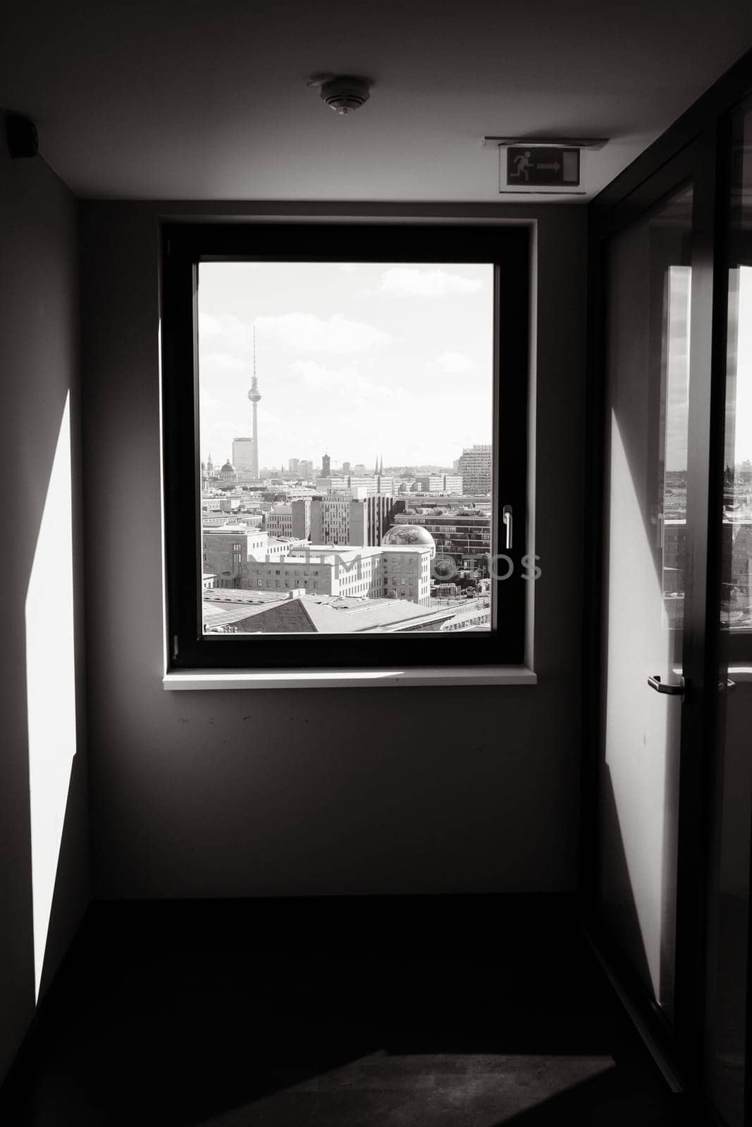 Berlin skyline with television tower through the window of a skyscraper in Germany