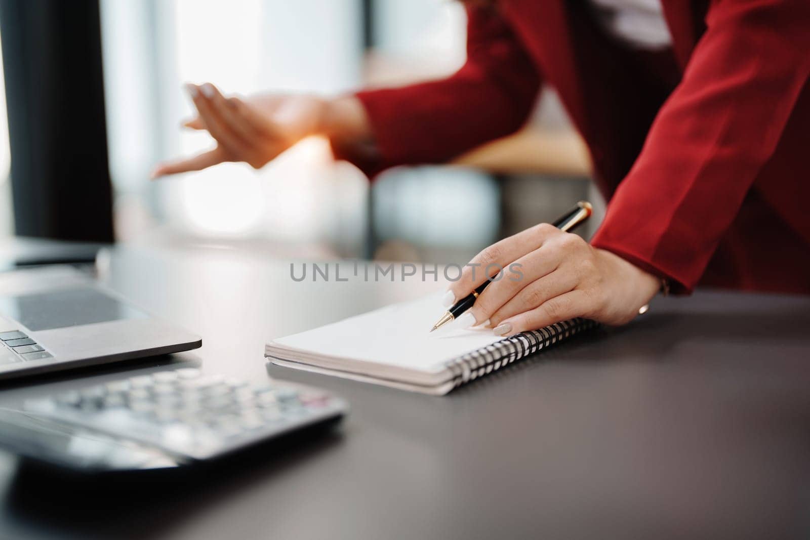 Beautiful young teen asian business woman meeting at on computer laptop with planning working on financial document, tax, exchange, accounting and Financial advisor.