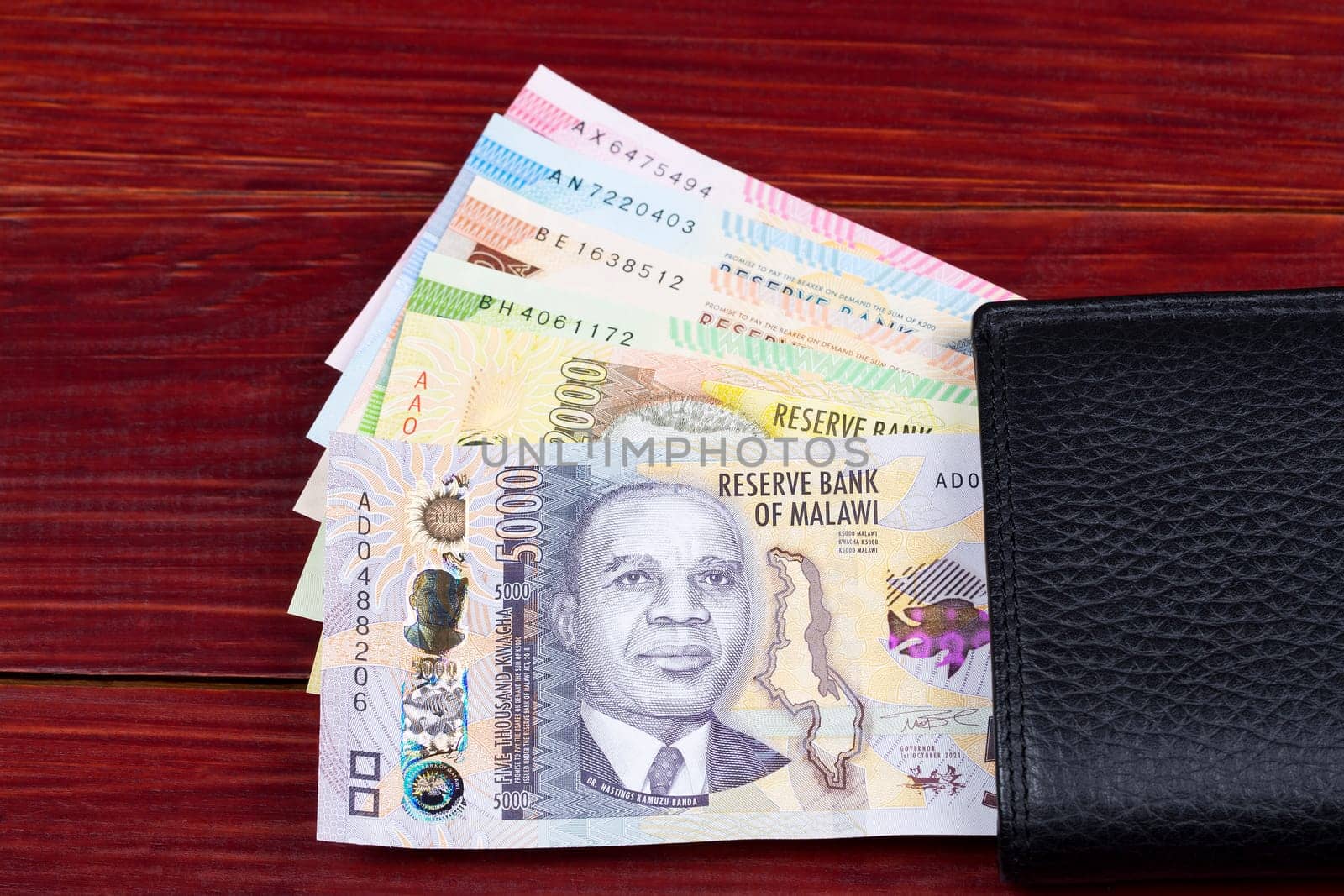 Malawian kwacha in the black wallet by johan10