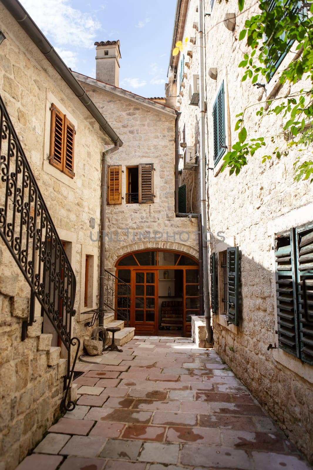 Colorful street in the old town of Kotor on a sunny day, Montenegro. Travel, vacation, walk