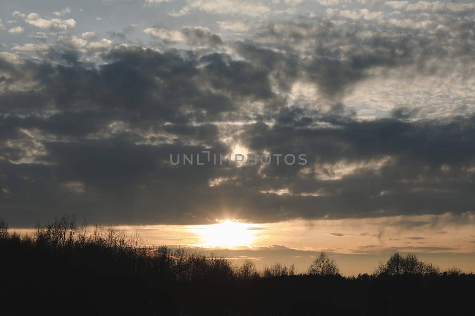 Natural sunset or sunrise. Bright dramatic Sky. Countryside Landscape under Scenic Colorful Sky at Sunset. Sun over skyline, Horizon