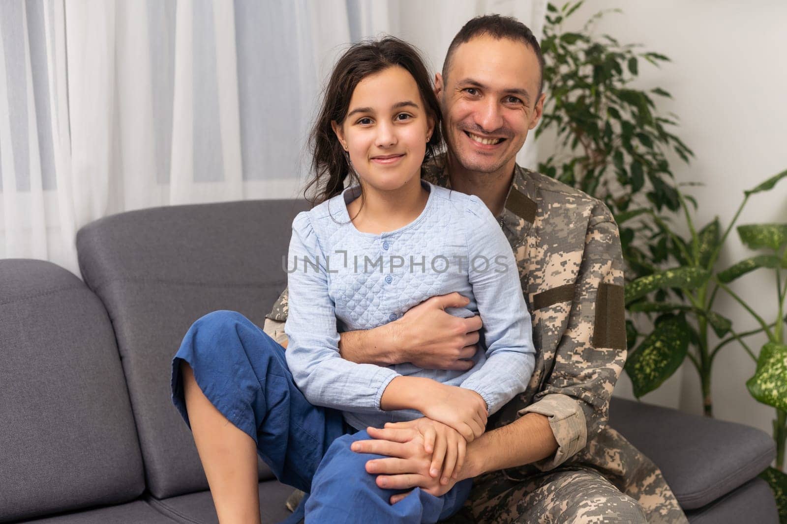 military father hugging his daughter. by Andelov13