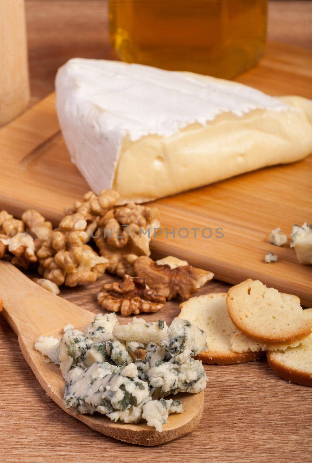 Dor blue and white cheese with nuts and honey by DCStudio