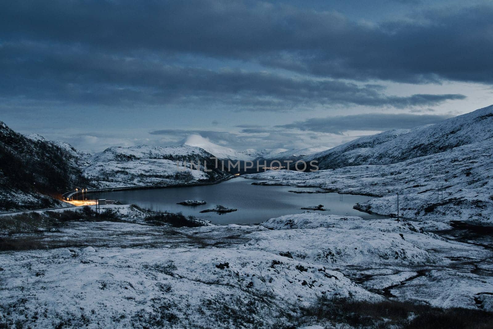 Lake Finnvikvatnet near Tromso in Norway during fall with snow