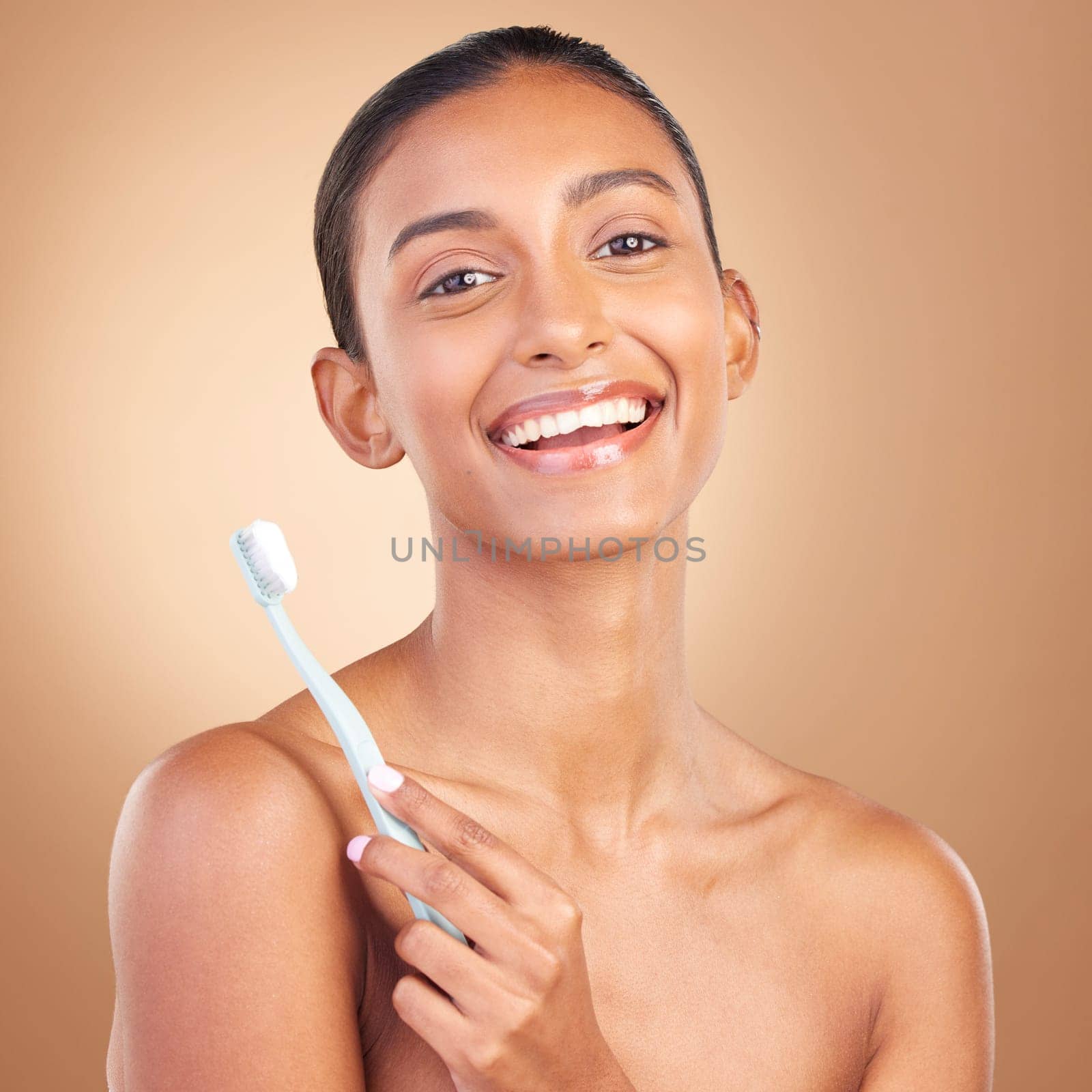 Beauty, smile and toothbrush with portrait of indian woman in studio for brushing teeth, dental and cosmetics. Oral hygiene, clean and self care with model on brown background for routine and health by YuriArcurs