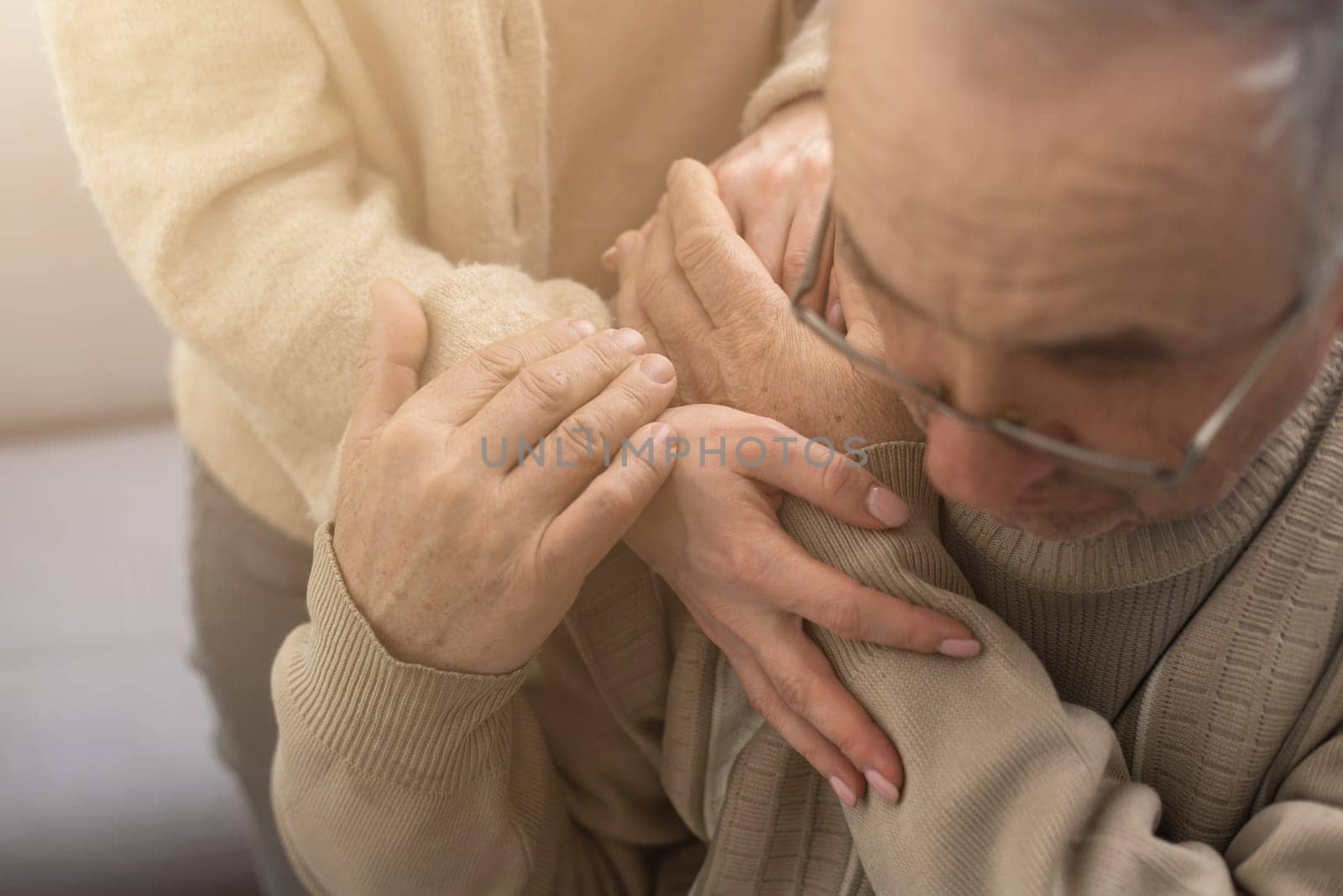 Hands of the old man and a young woman. close up