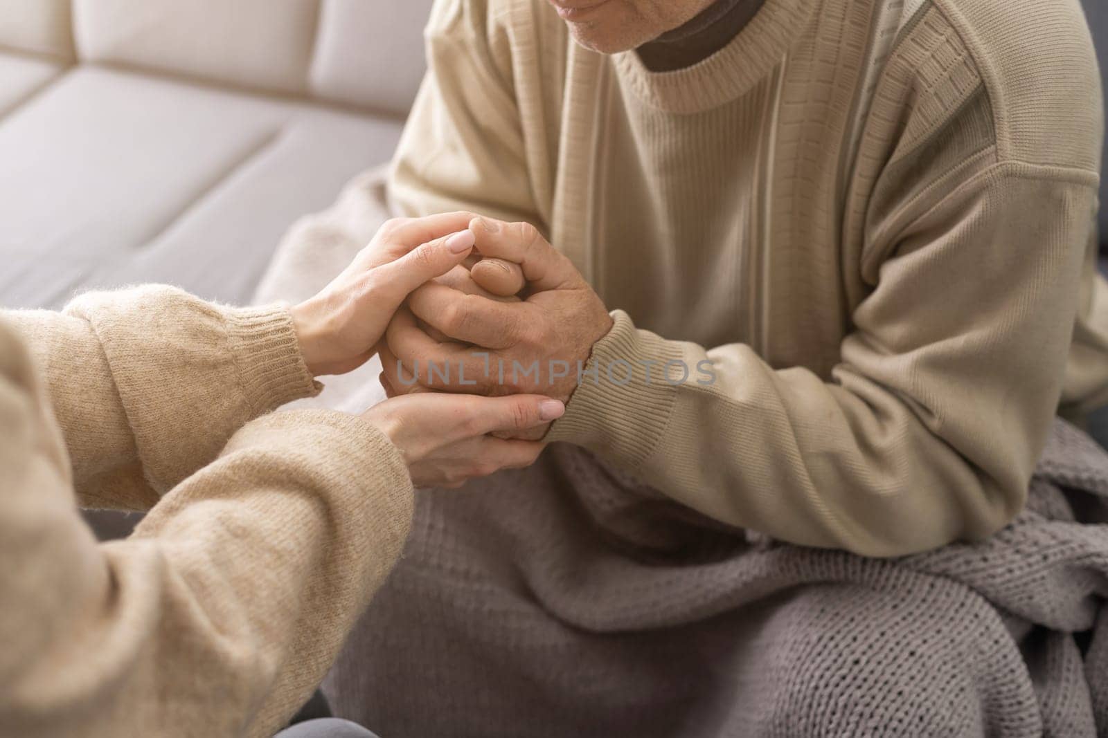 Hands of the old man and a young woman. close up