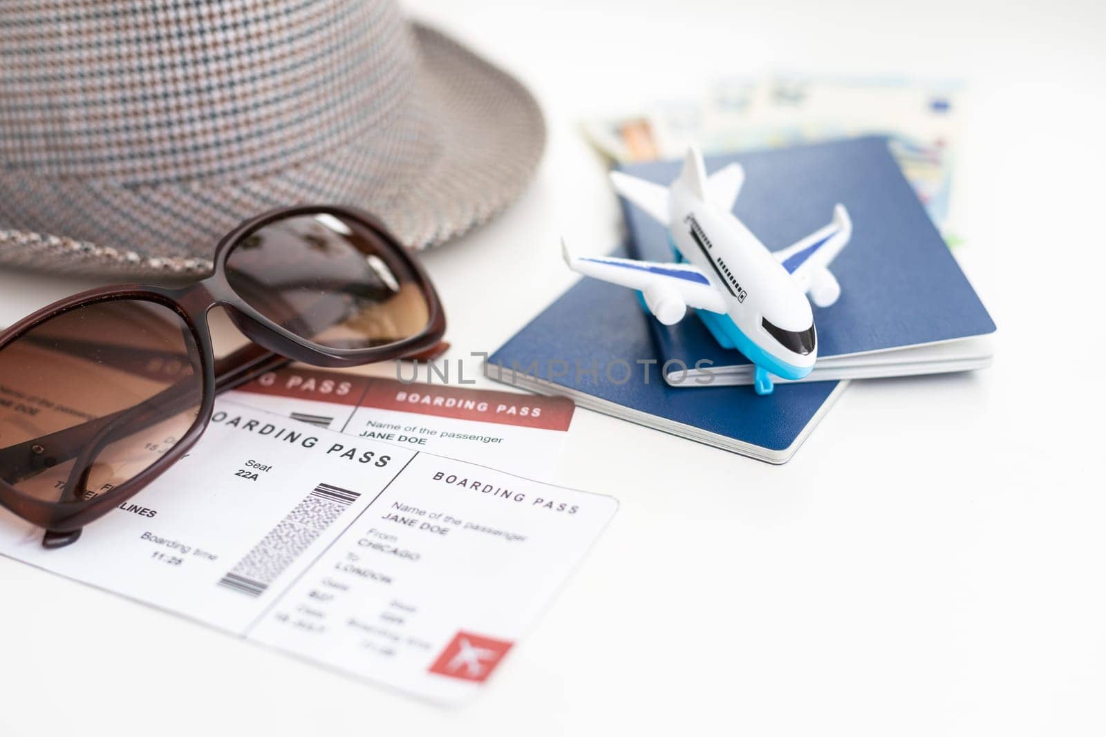 Planning vacation to the seaside with hat, sun glasses, passport, tickets.