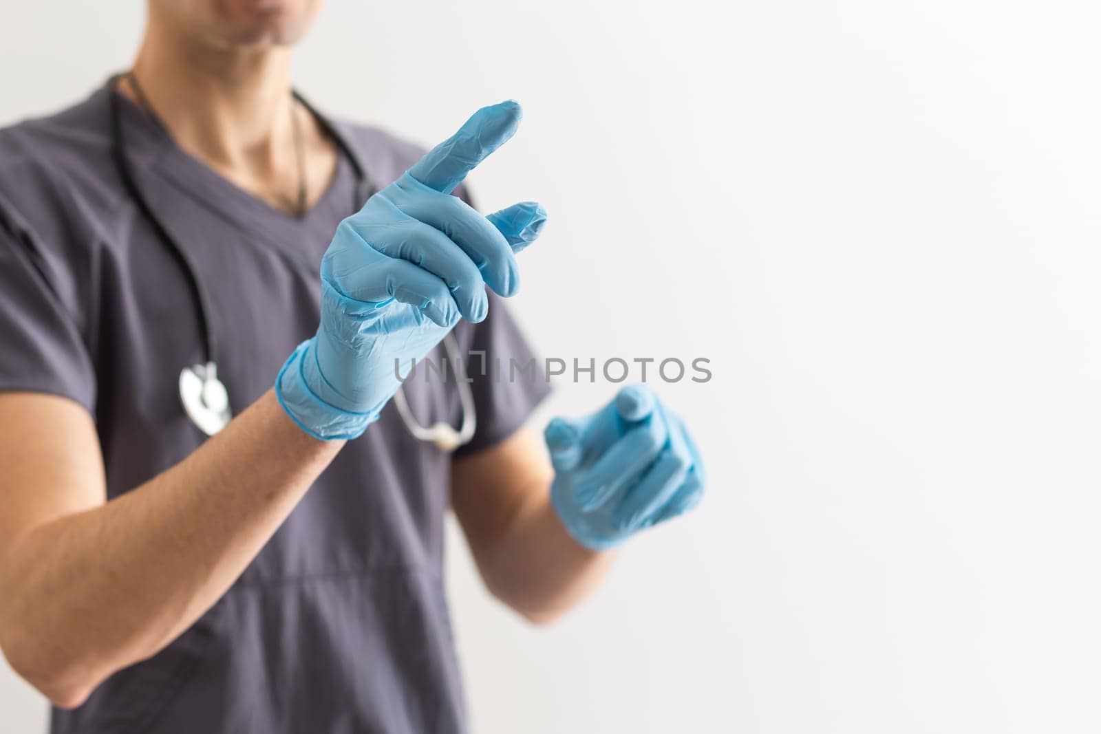 View of a Doctor pointing his finger at the clinic. by Andelov13