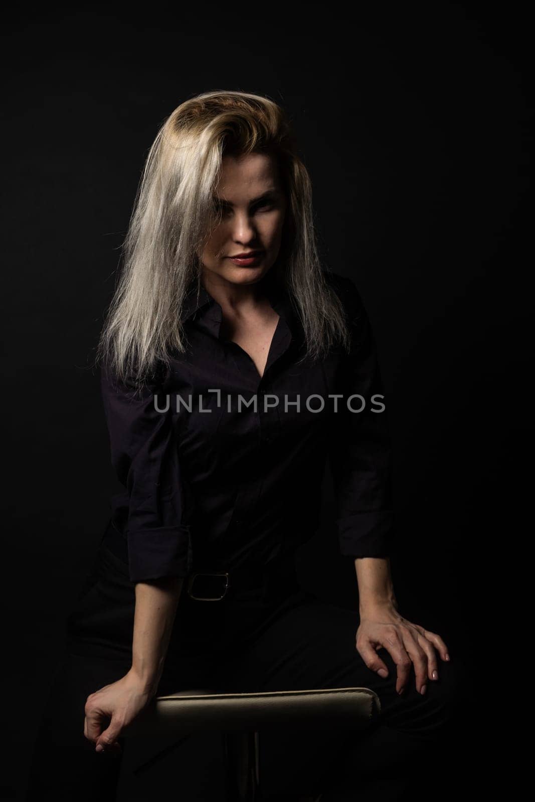 Portrait of beautiful female model on black background. by Andelov13