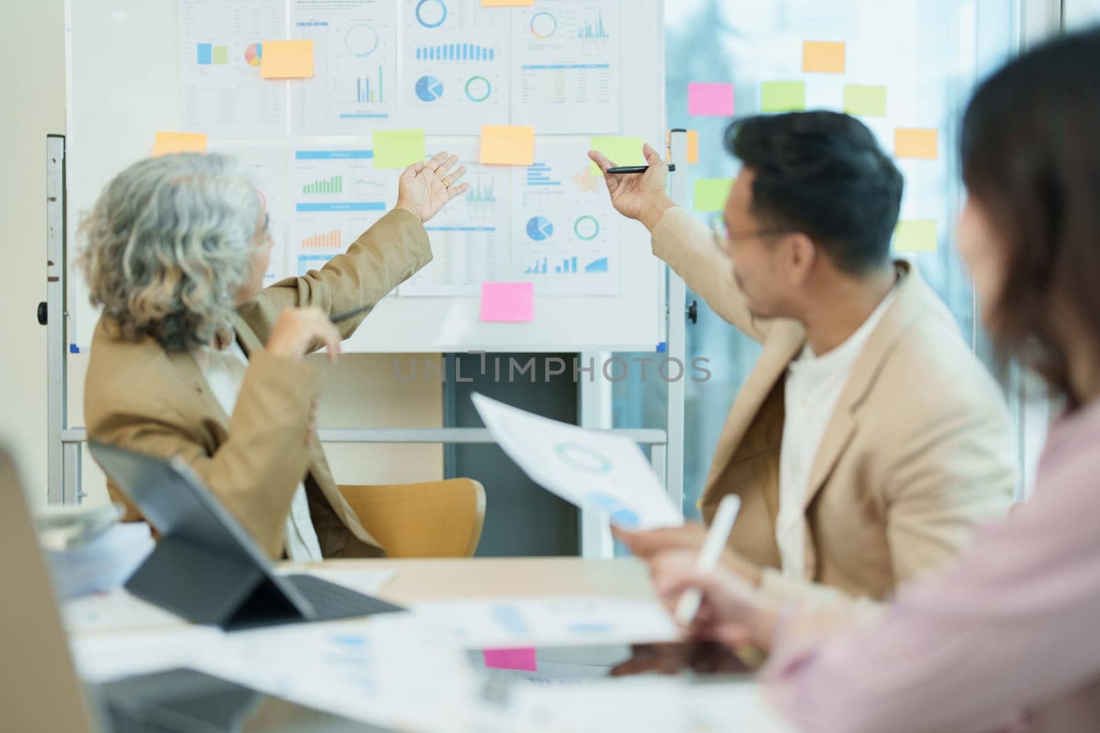 Asian entrepreneurs and business people meeting in a conference room in business planning, financial budget and investment risk assessment to analyze customer groups to increase company growth.