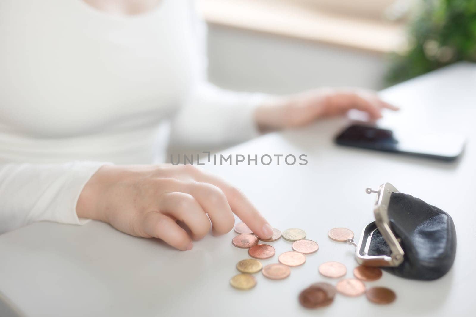 Bank, coins and mobile in tax files for financial year or consulting at work desk or at home. Economy, money and accountant working on corporate documents and administration for management. financial