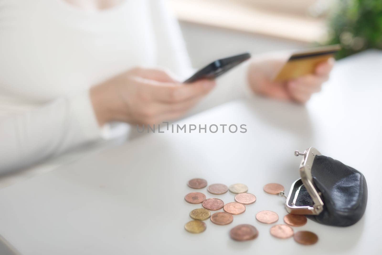 Bank, coins and mobile in tax files for financial year or consulting at work desk or at home. Economy, money and accountant working on corporate documents and administration for management. financial
