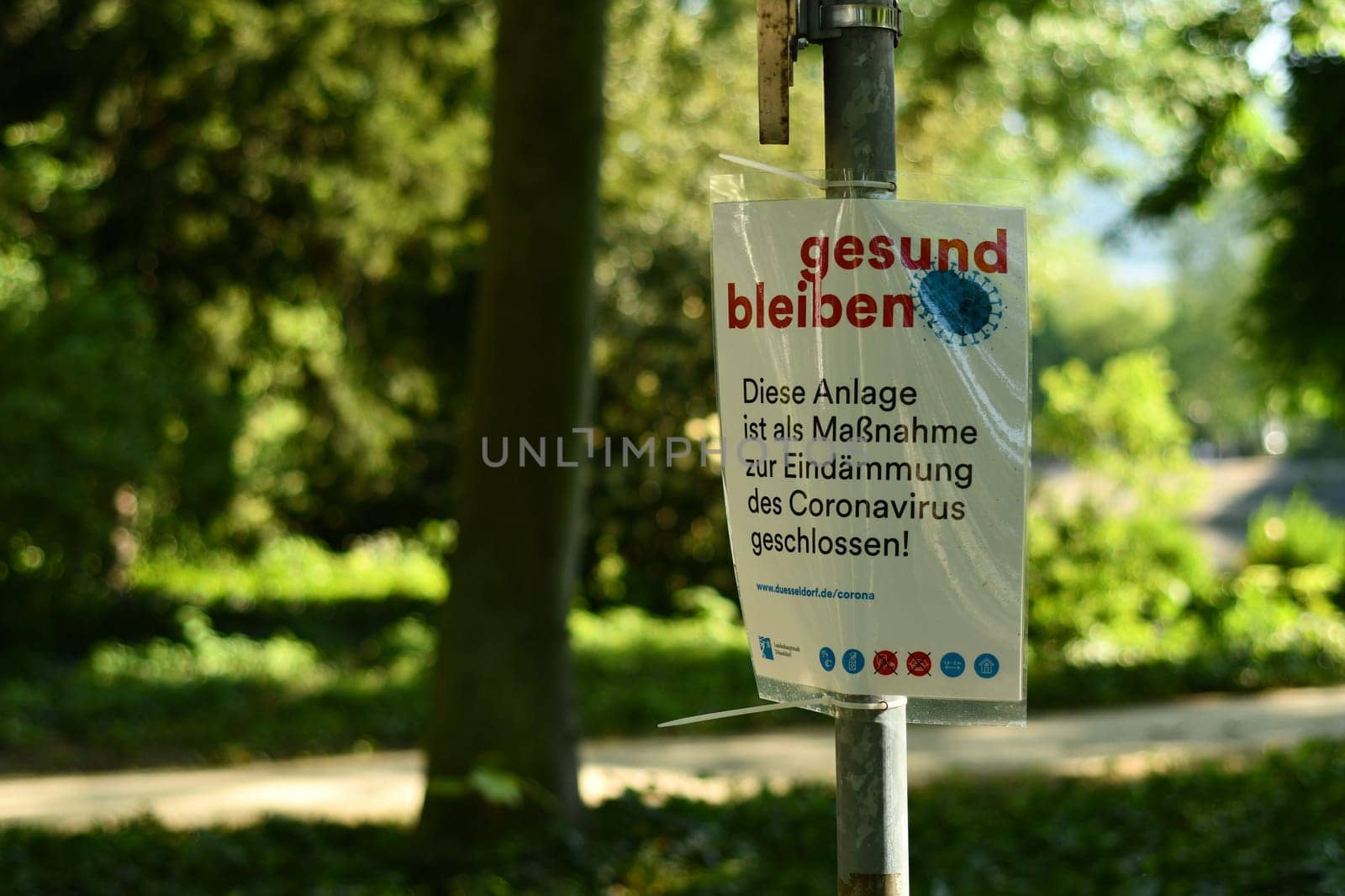 Stay healthy Sign with Covied-19 with hints and rules in a park in Duesseldorf, Germany