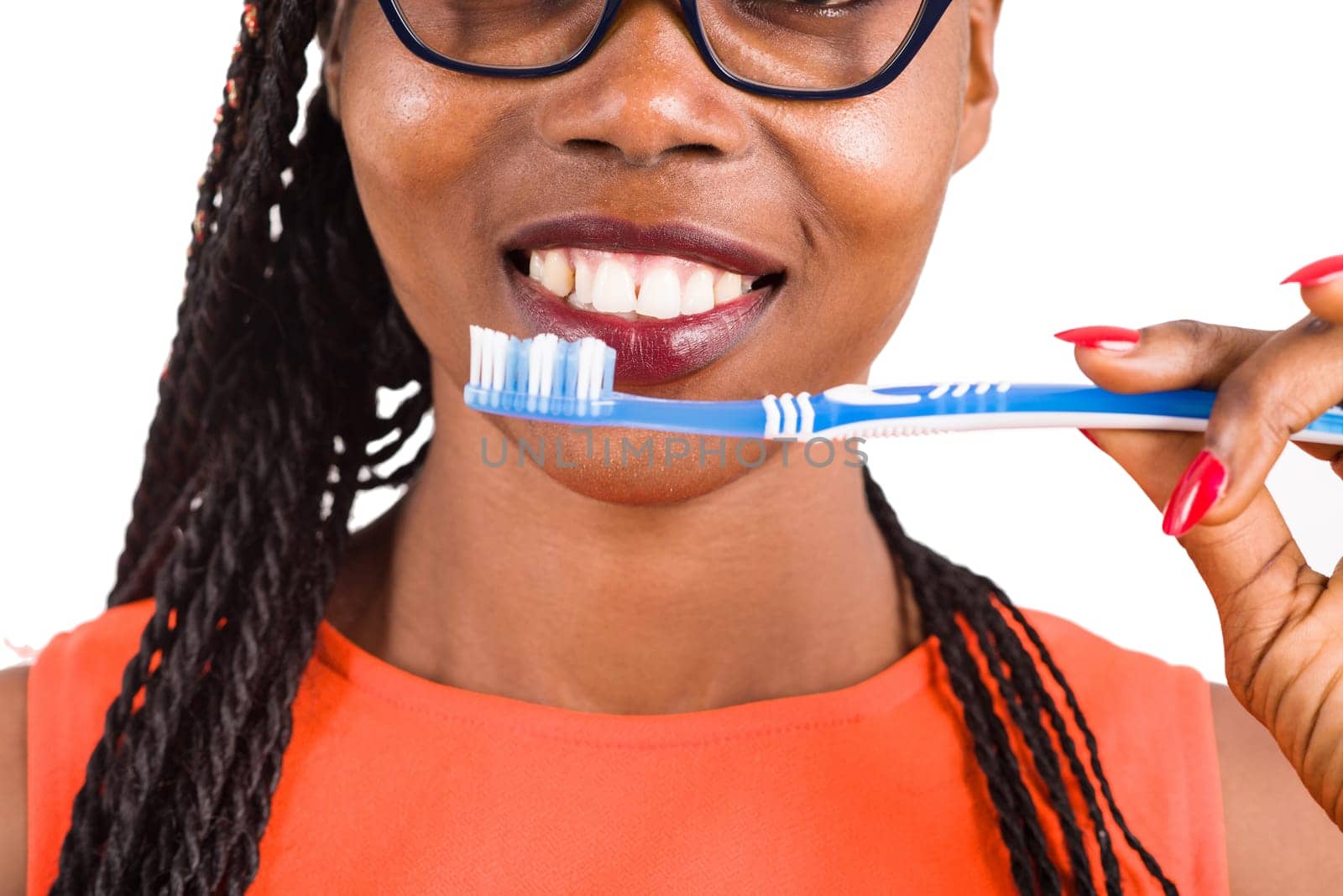 Close-up of young girl with toothbrush, smiling. by vystek