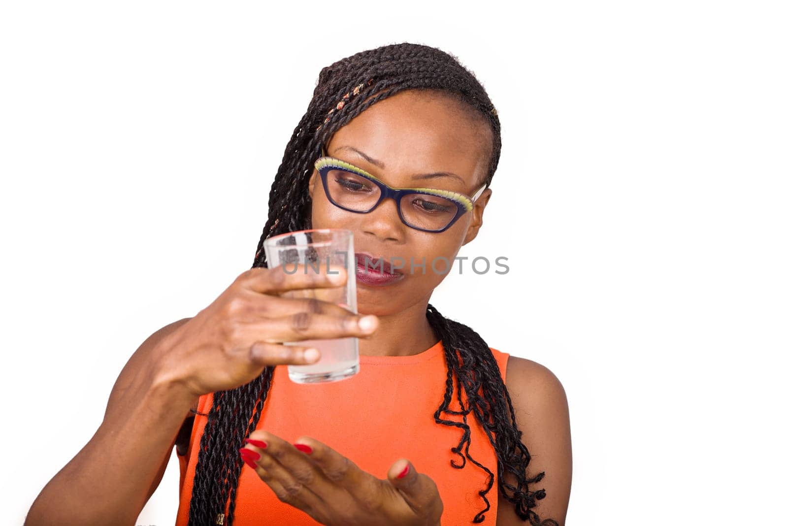 young girl standing in glasses watching a glass half full.