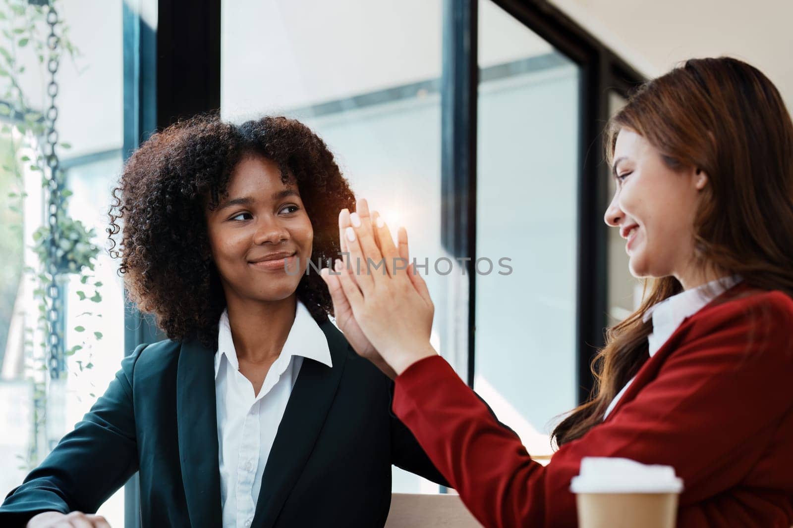 Multiethnic business, Beautiful American African and asian businesswoman people meeting Diverse Happy people celebrating success at company, teamwork, triumph, victory, achievement concept.