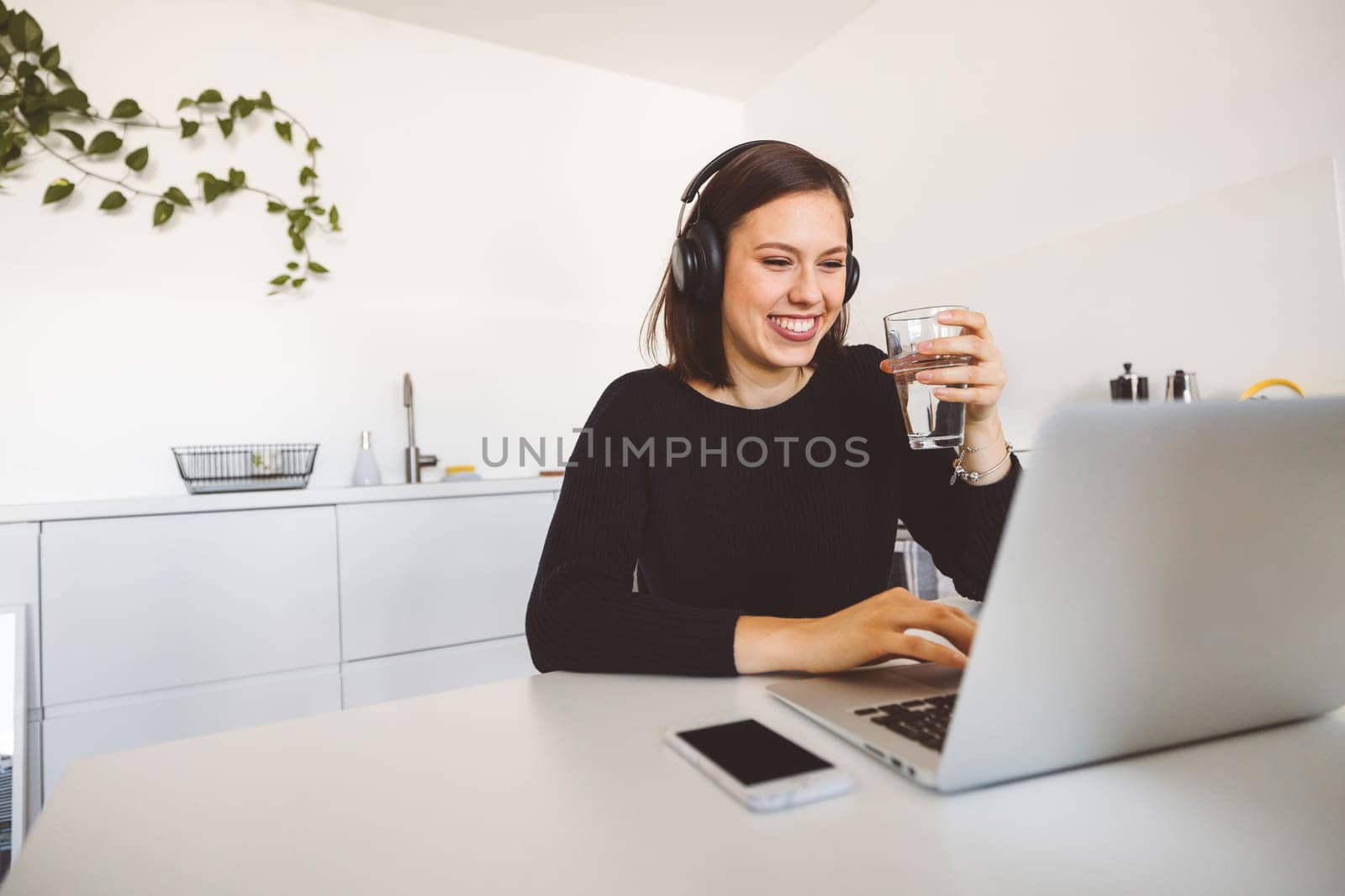 Young caucasian woman student studying at home in her apartment. Sorority concept. High quality photo