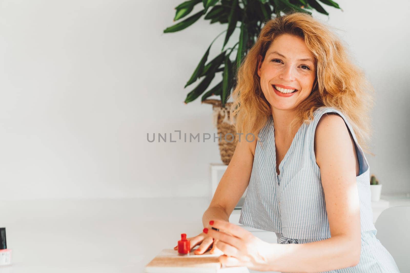 Self-Care Concept. Portrait Of Attractive Adult Female doing skin and hair care at home. Beauty at home. Woman doing make up, brushing her hair. High quality photo