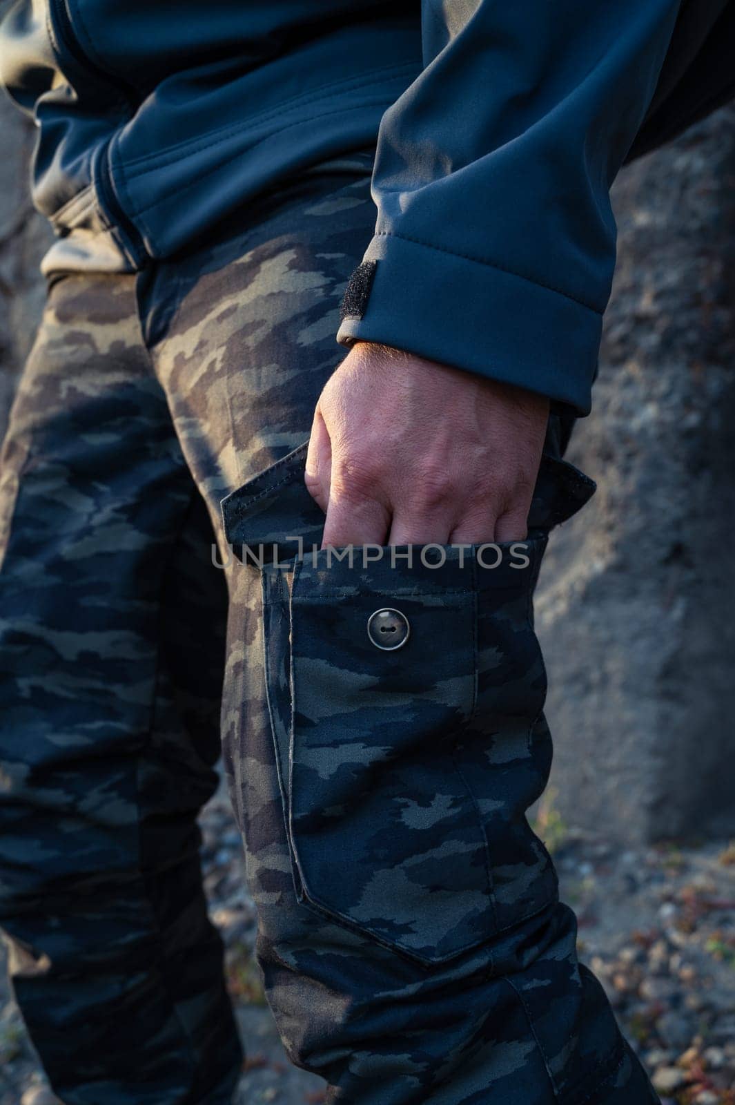 Man tourist standing in military outfit outdoor. Travel or military concept