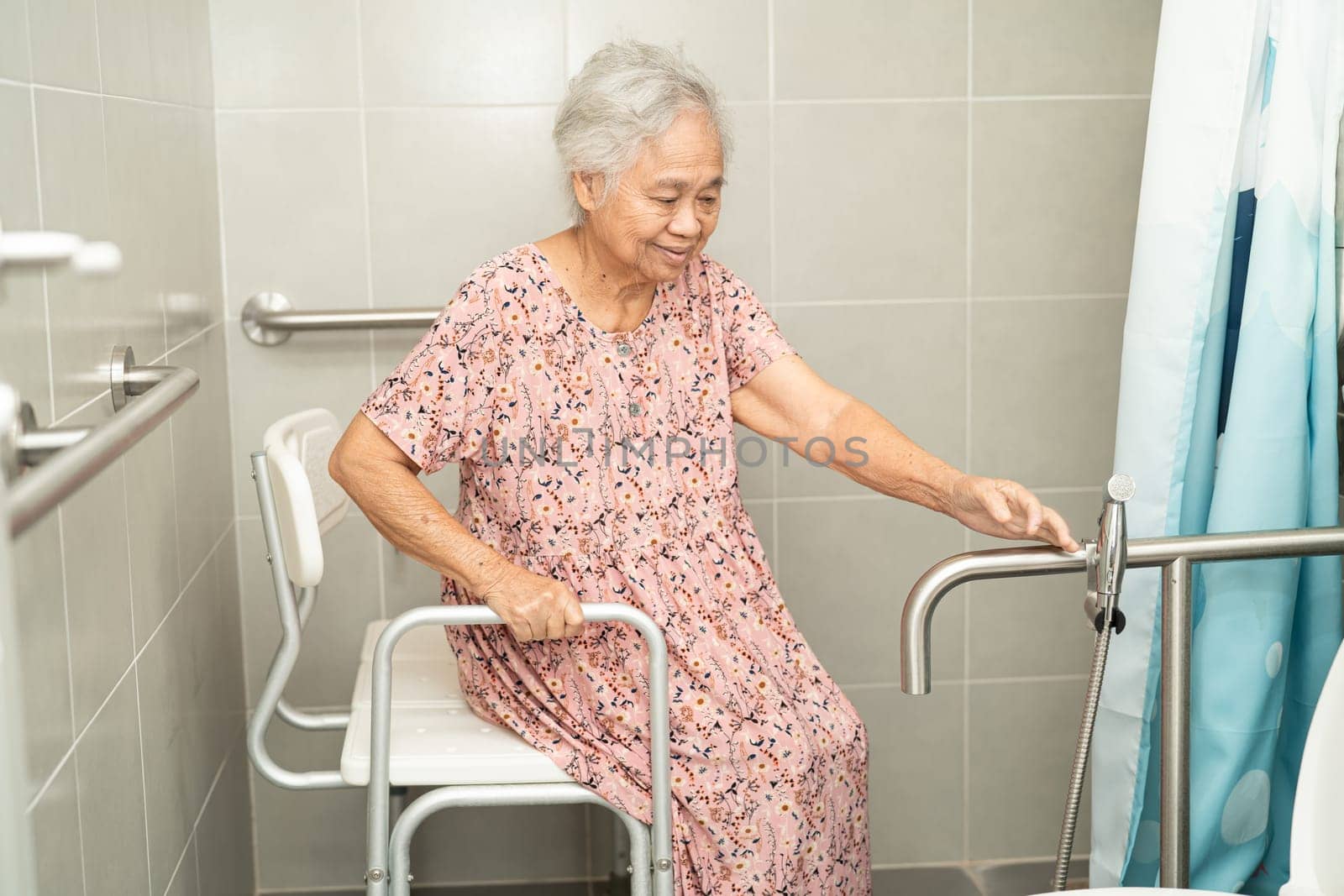 Asian senior or elderly old lady woman patient use toilet bathroom handle security in nursing hospital, healthy strong medical concept. by pamai