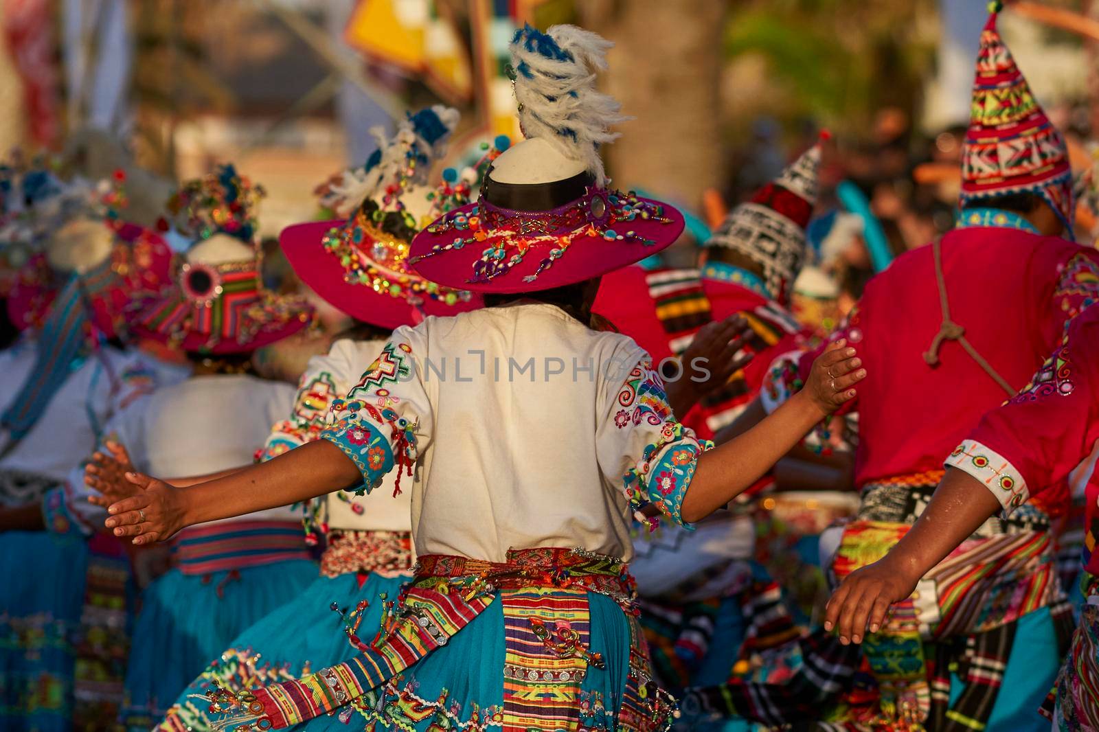 Arica, Chile - January 23, 2016: Tinkus dancing group in colourful costumes performing a traditional ritual dance as part of the Carnaval Andino con la Fuerza del Sol in Arica, Chile.