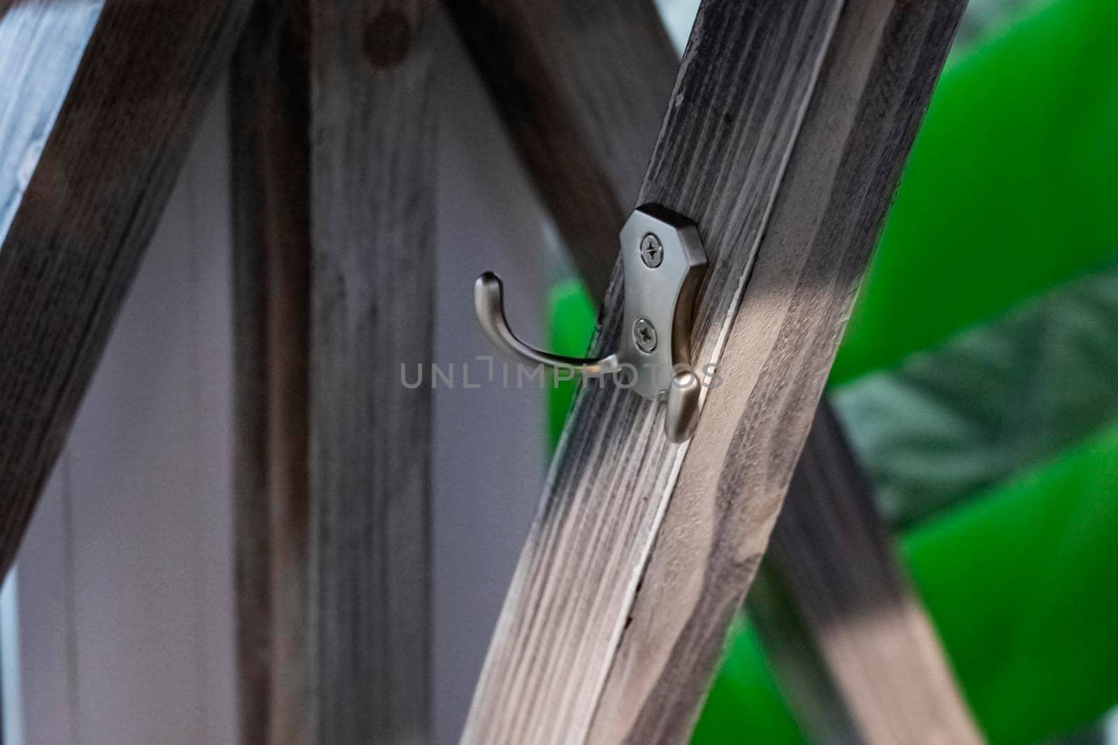 Clothes hook on a wooden wall close up