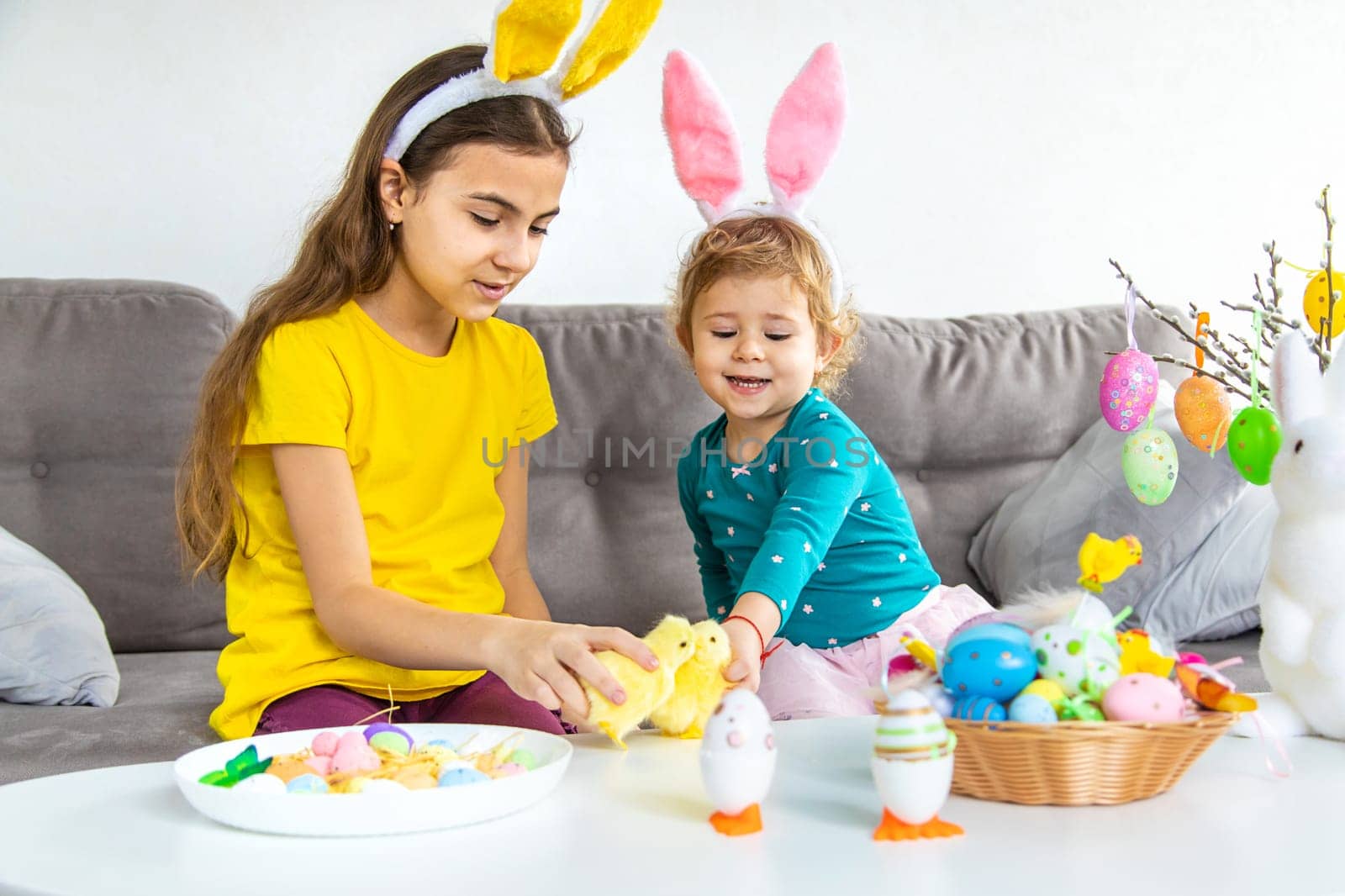 Happy Easter kids with eggs. Selective focus. by yanadjana