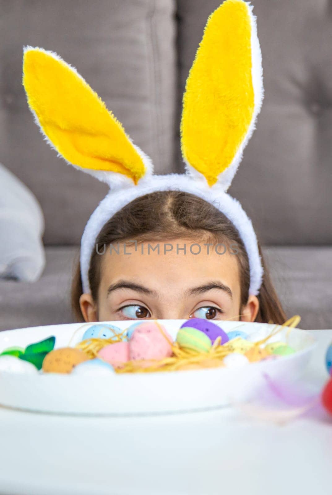 Happy Easter kids with eggs. Selective focus. by yanadjana