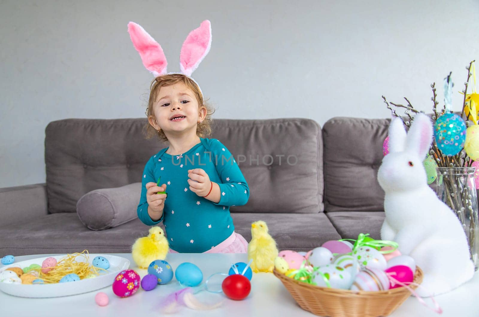 Happy Easter kids with eggs. Selective focus. by yanadjana