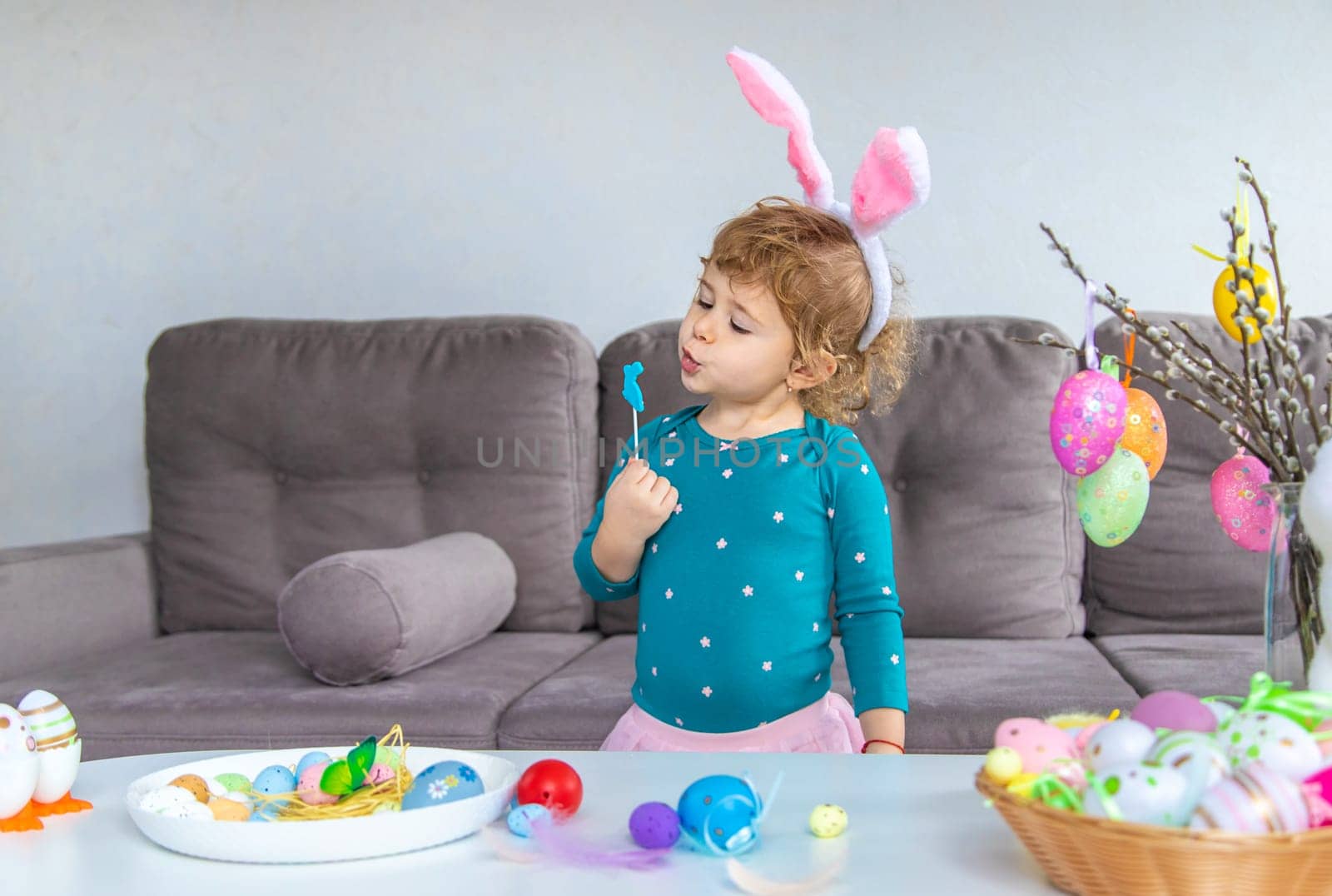 Happy Easter kids with eggs. Selective focus. by yanadjana