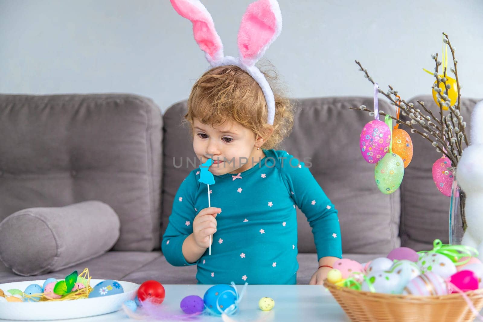 Happy Easter kids with eggs. Selective focus. by yanadjana