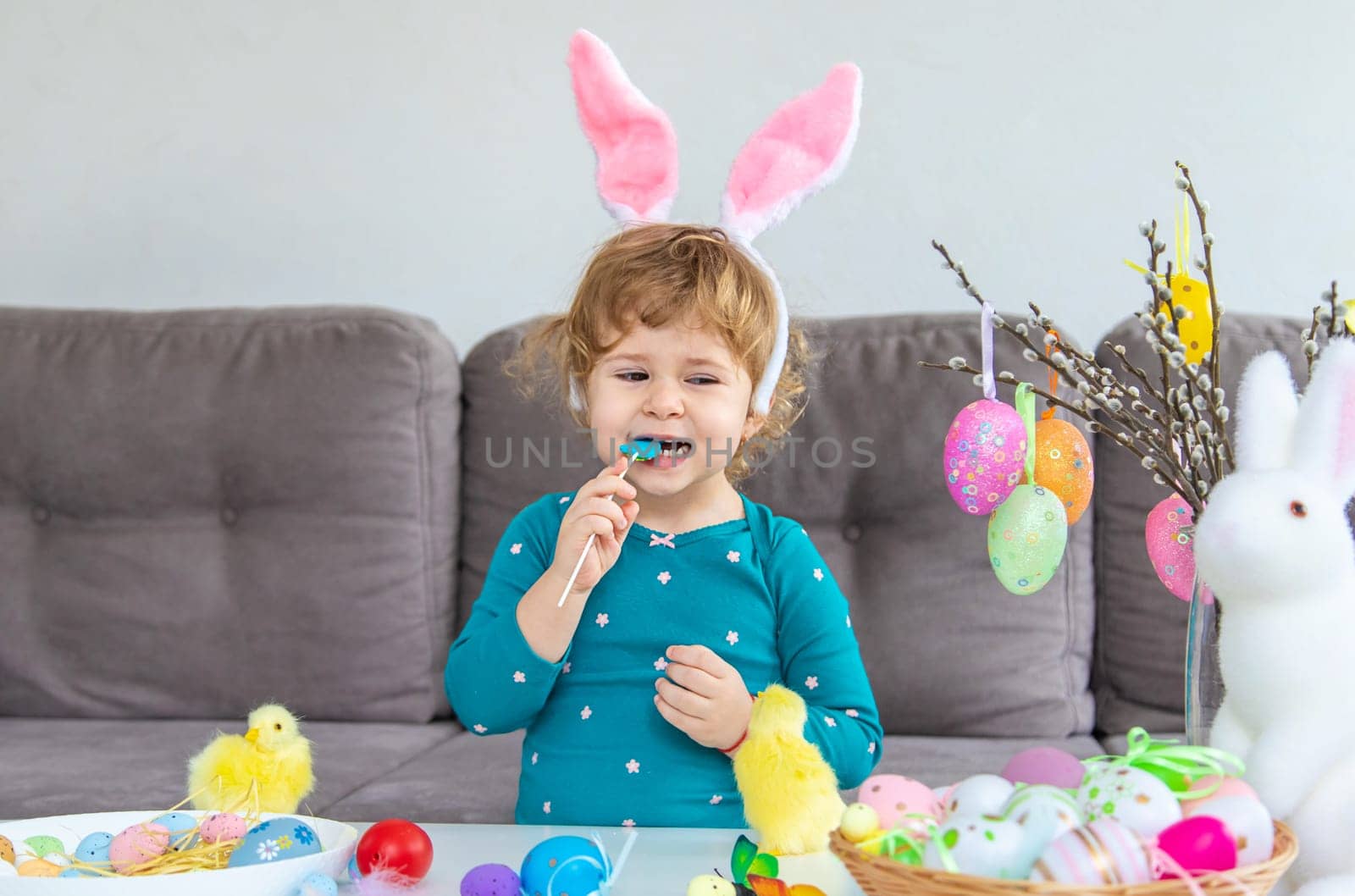 Happy Easter kids with eggs. Selective focus. by yanadjana