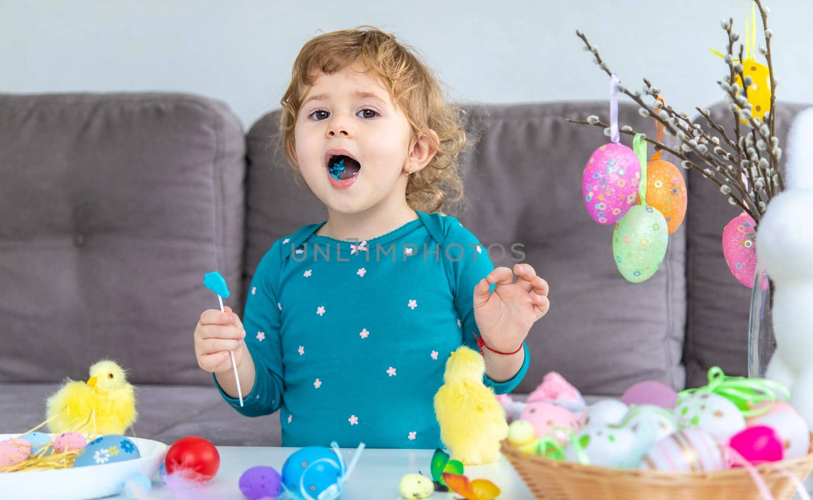 Happy Easter kids with eggs. Selective focus. by yanadjana