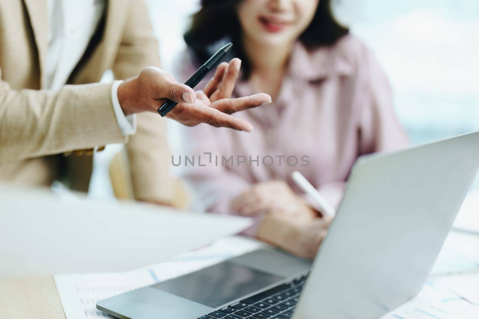 Asian entrepreneurs and business people meeting in a conference room in business planning, financial budget and investment risk assessment to analyze customer groups to increase company growth by Manastrong