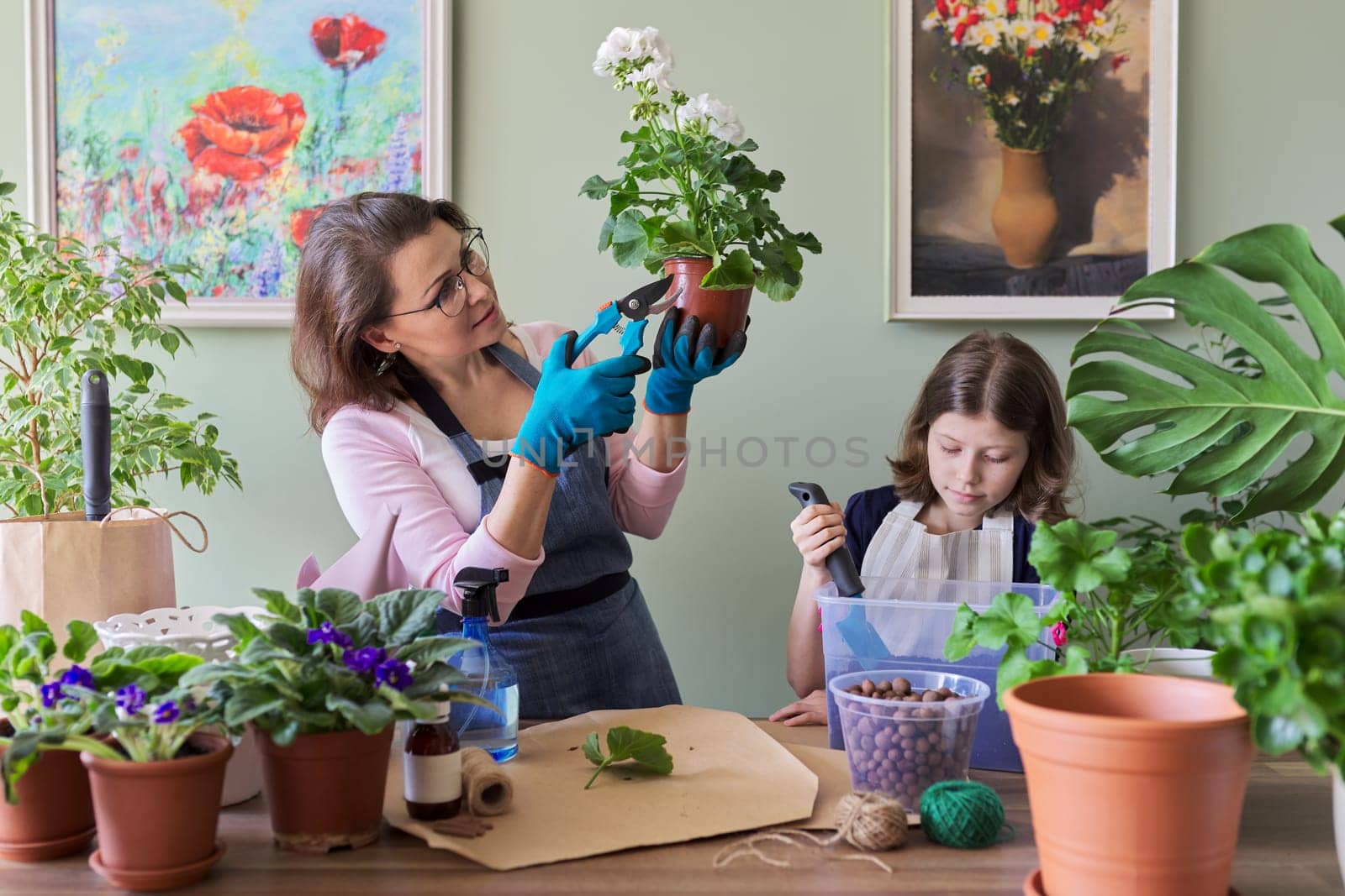 Mother and daughter child plant potted flowers by VH-studio