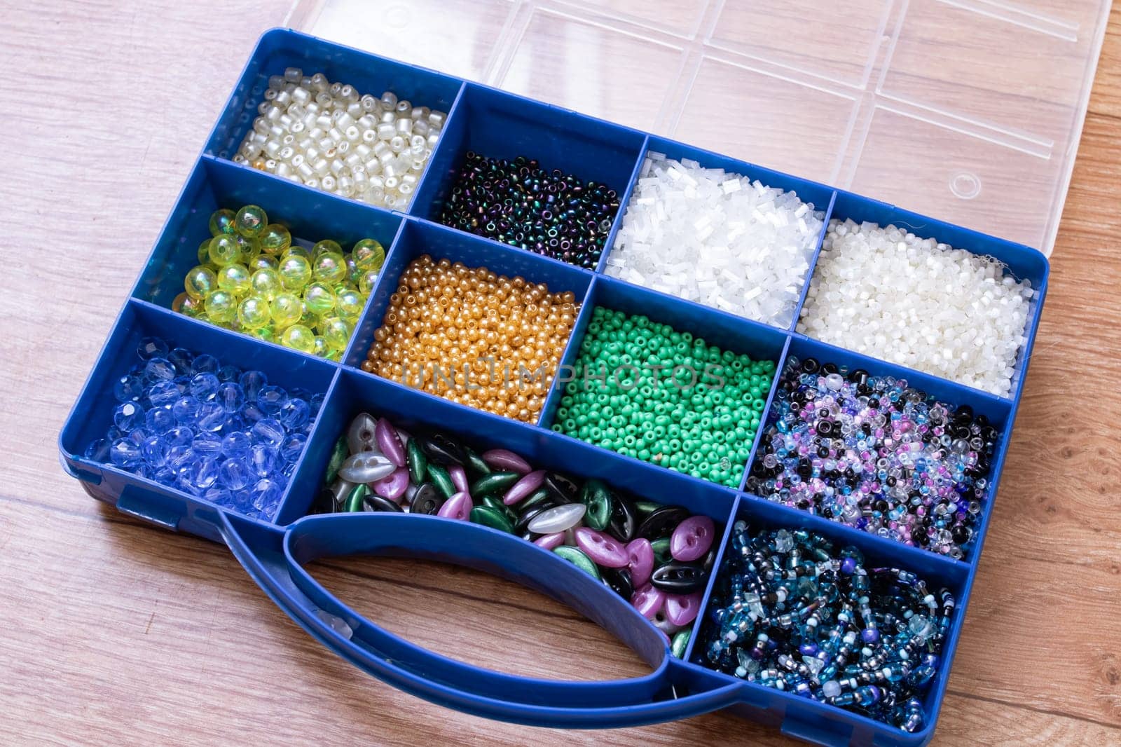 Colorful beads in containers close up, handicrafts, macrophoto