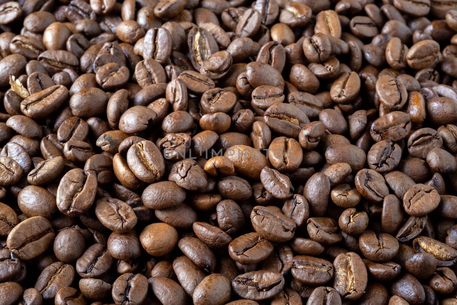 Roasted coffee beans background. Selective focus.