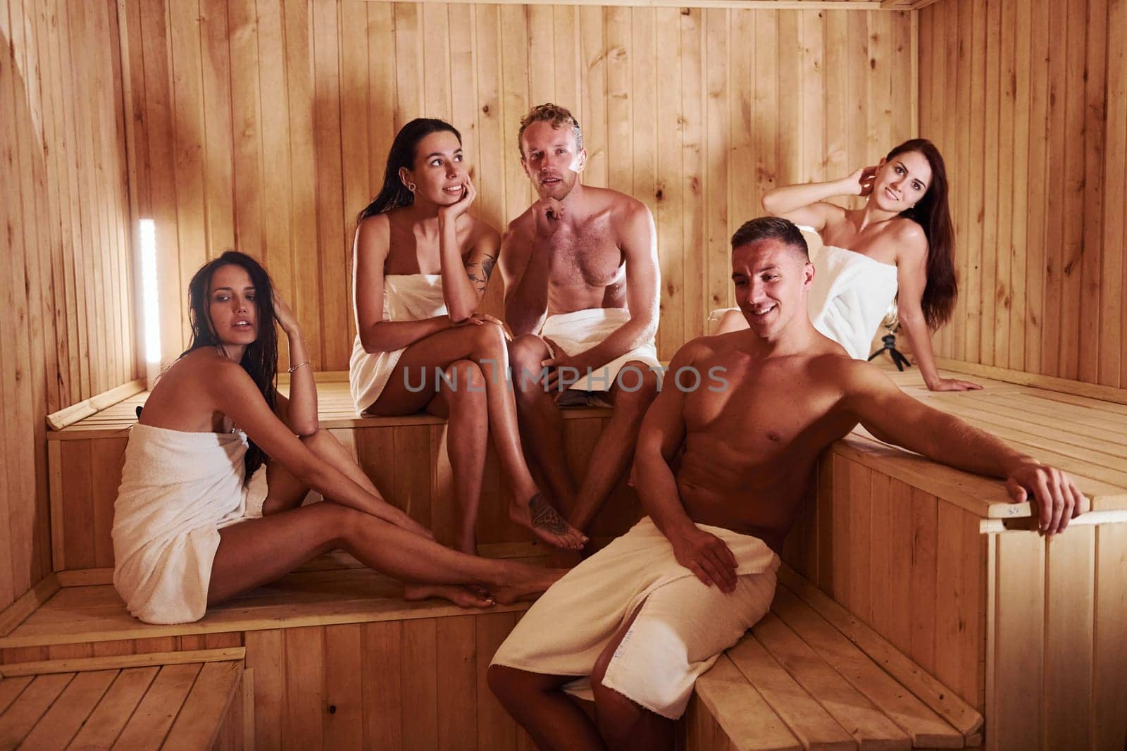 Group of young people together in sauna. Conception of vacation and weekend.