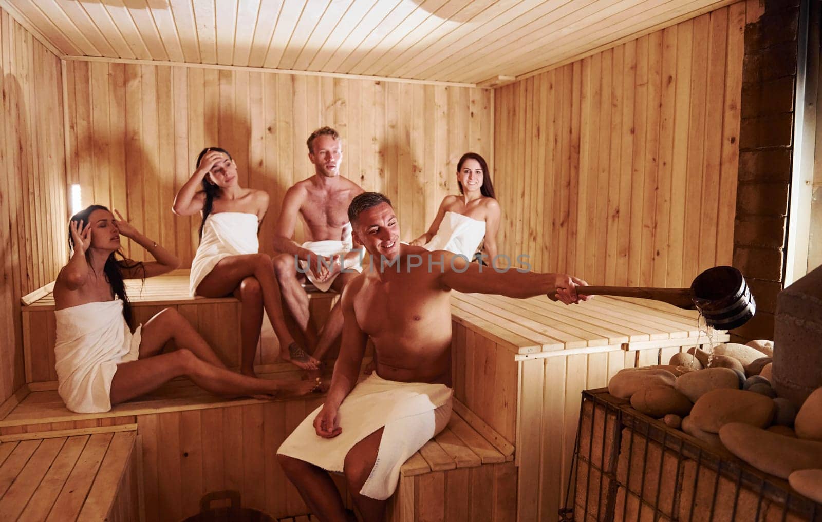 Group of young people together in sauna. Conception of vacation and weekend by Standret