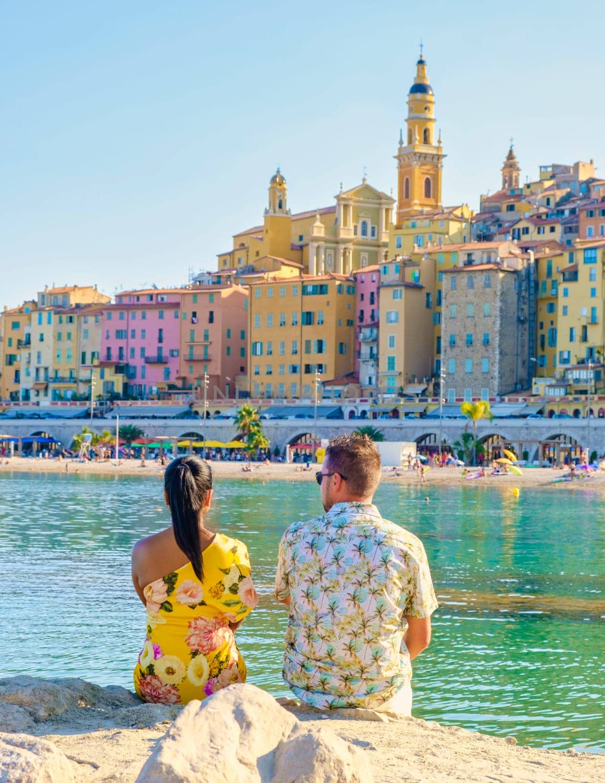 Menton France,couple men and woman on vacation at the Cote d Azur France, View on old part of Menton by fokkebok