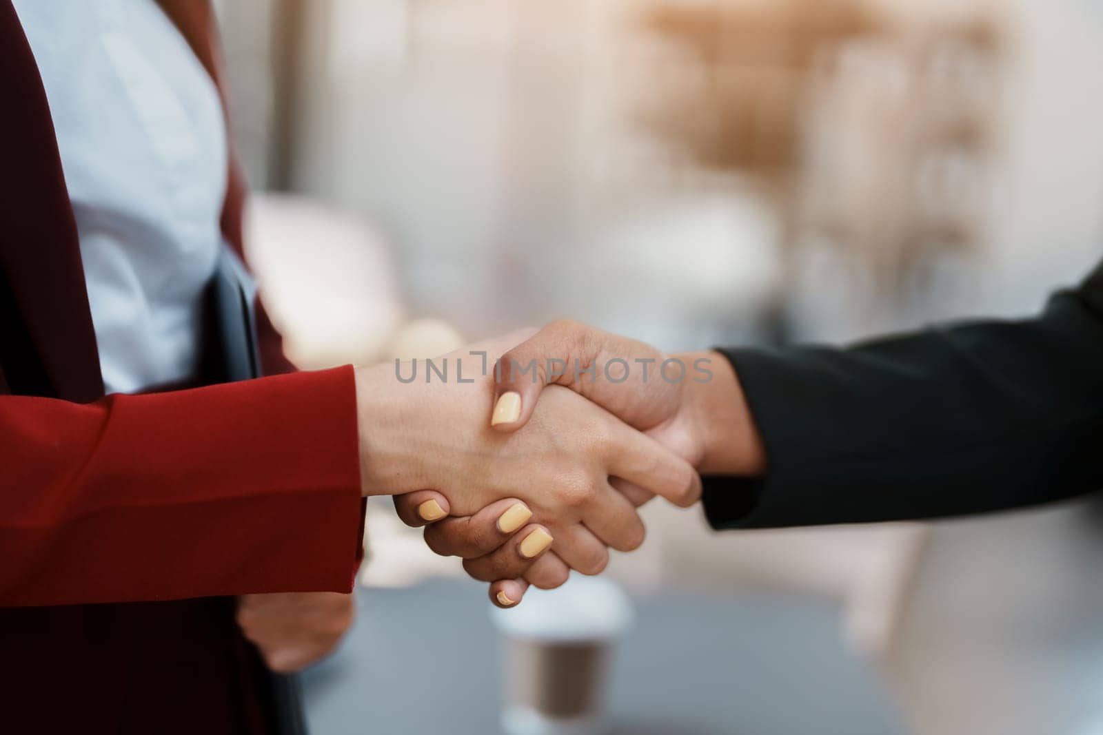 Multi ethnic business Financial shaking hands, Successful businessmen handshaking after good deal. Business Finishing up meeting contract concept by Manastrong