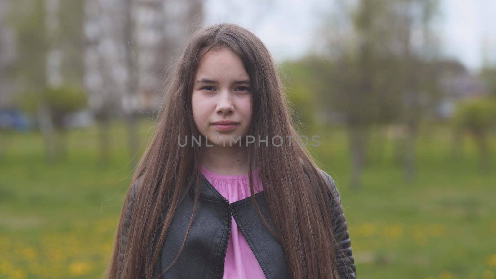 Portrait of a beautiful long-haired teenage girl