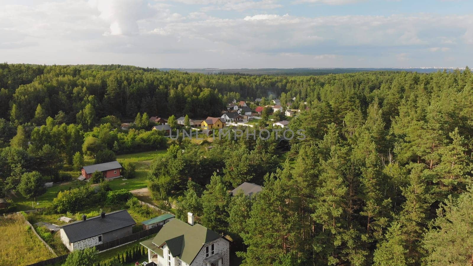 Country houses in the woods. Drone video