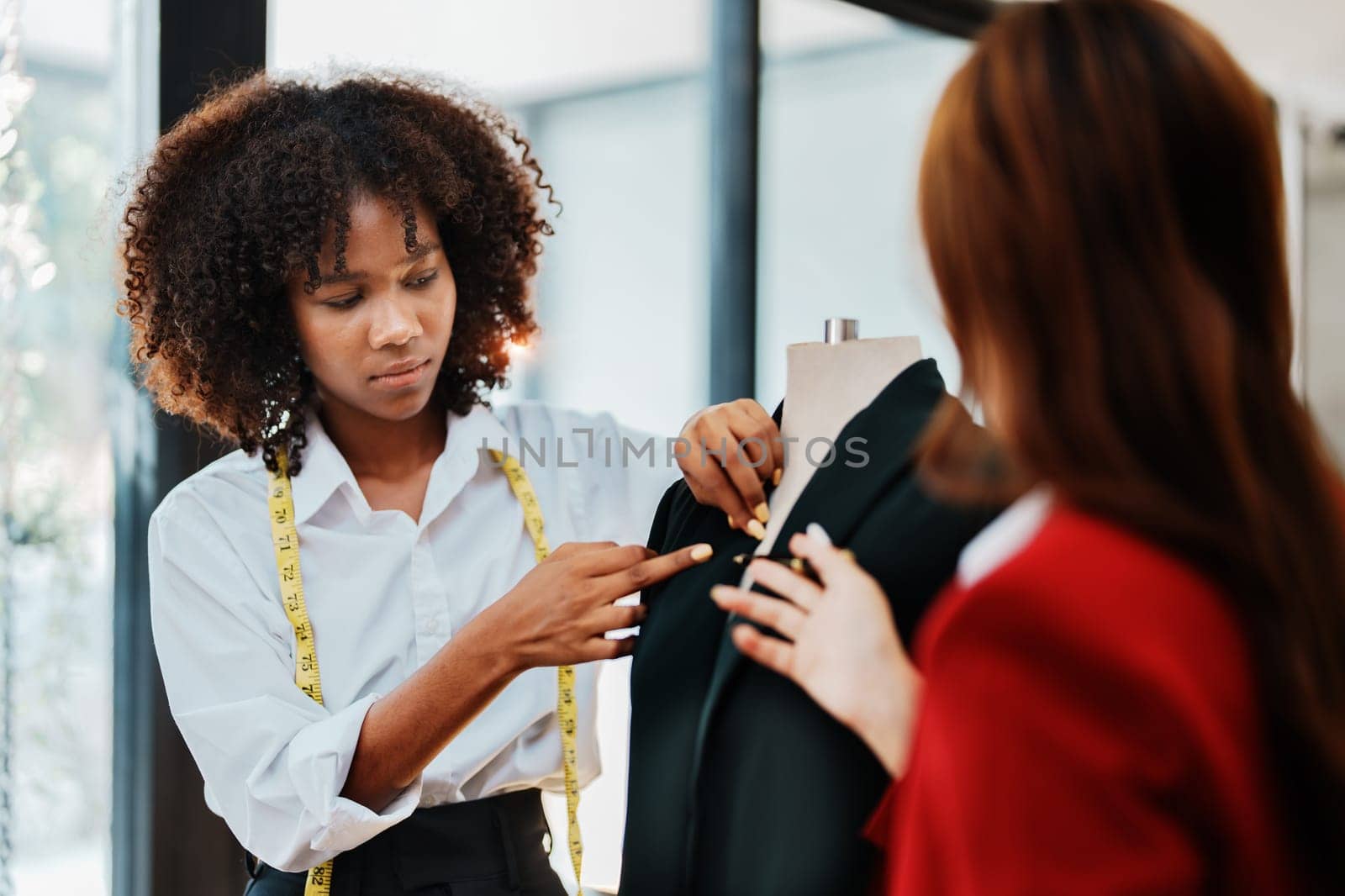 Multi ethnic young teen african american and asian woman fashion designer stylish and friend working at fashion Business studio.