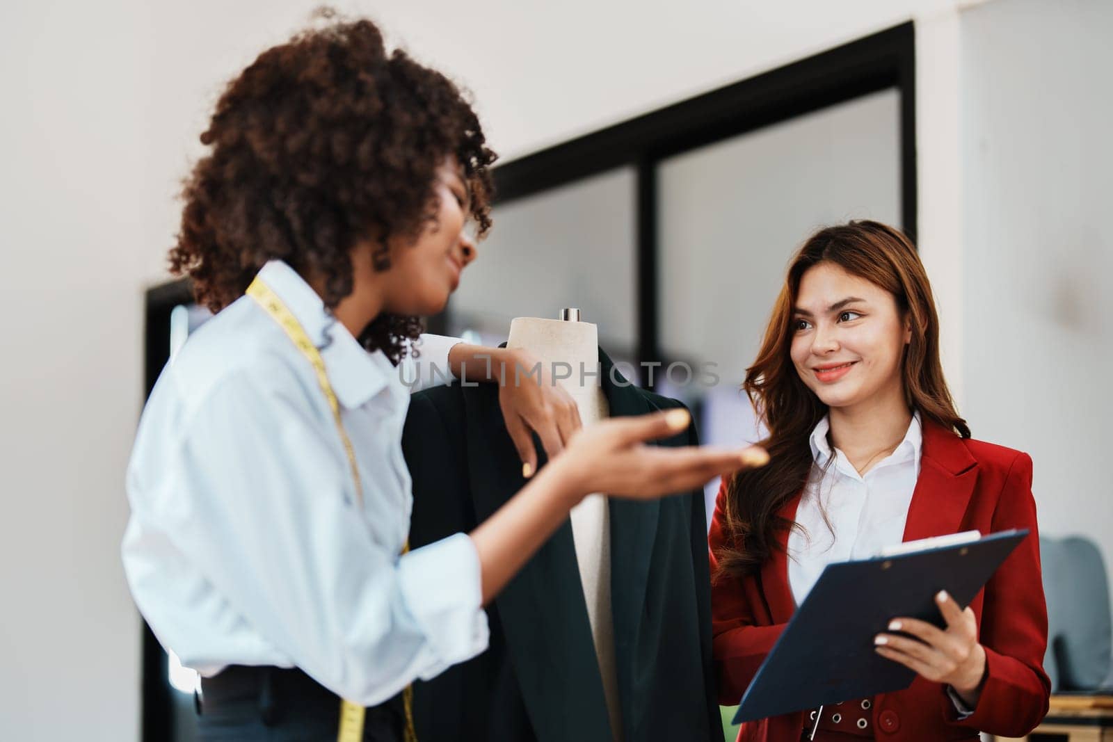 Multi ethnic young teen african american and asian woman fashion designer stylish and friend working at fashion Business studio.