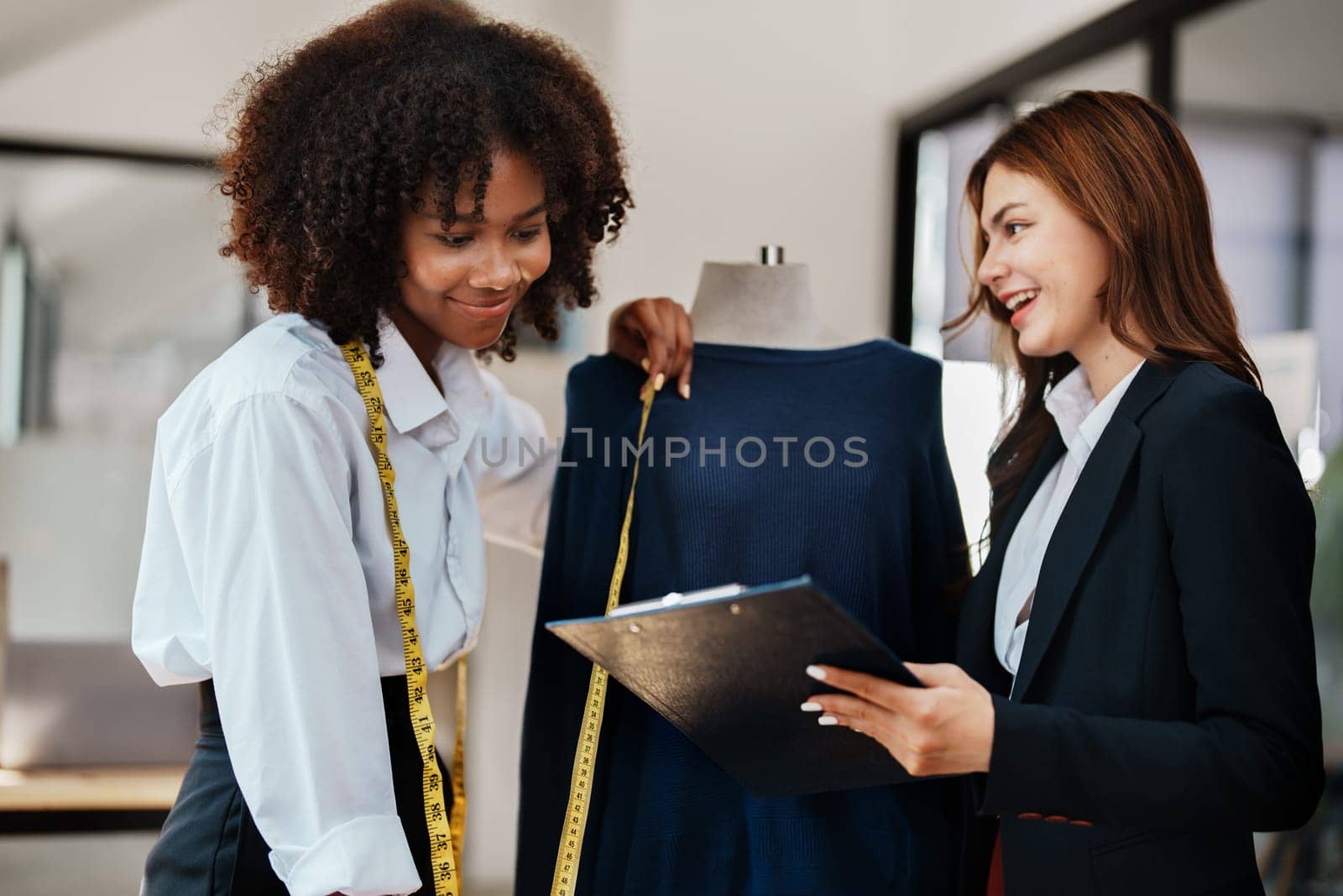 Multi ethnic young teen african american and asian woman fashion designer stylish and friend working at fashion Business studio.